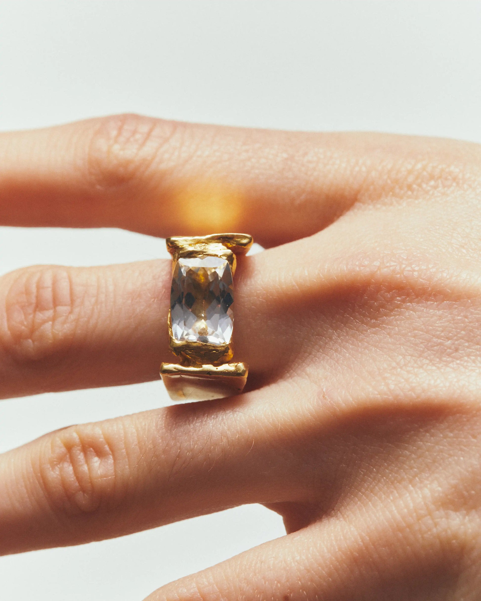 04 april white topaz ring gold hands 1